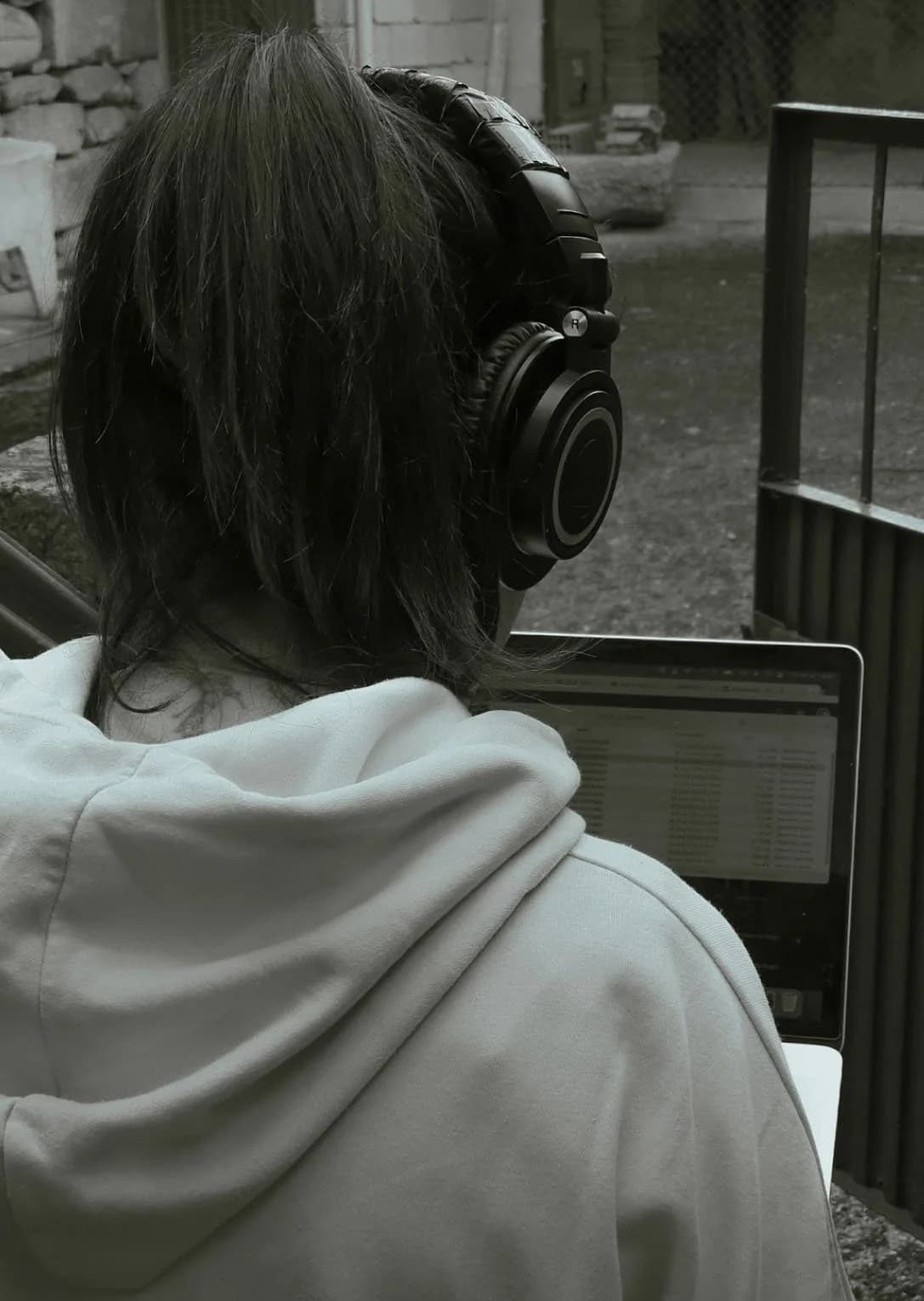 Catarina Moura editing with headphones